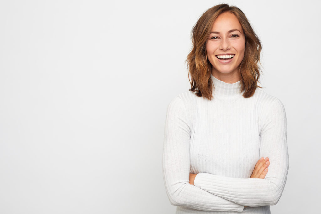 woman smiling in turtleneck