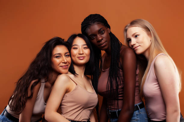 4 women with different shades of skin