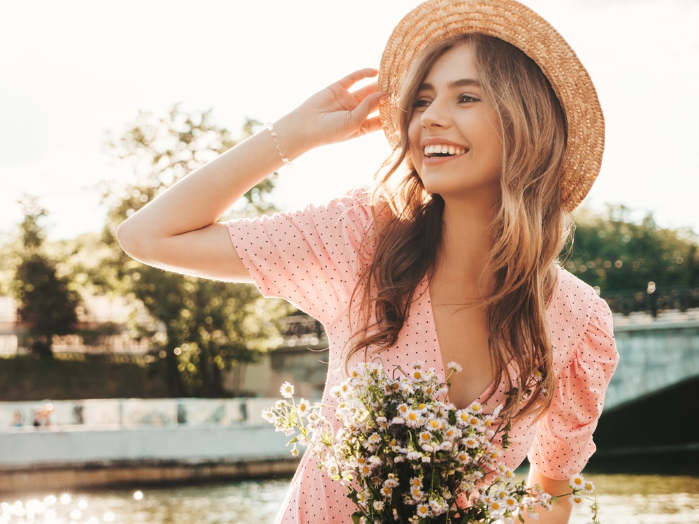 Woman smiling at a wedding with clear skin from dermaplaning in Littleton, CO