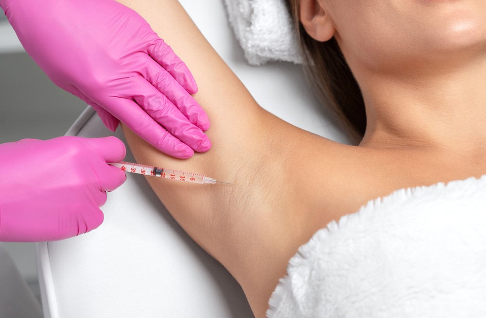 Woman getting injections in her underarm for excessive sweating in Littleton, CO